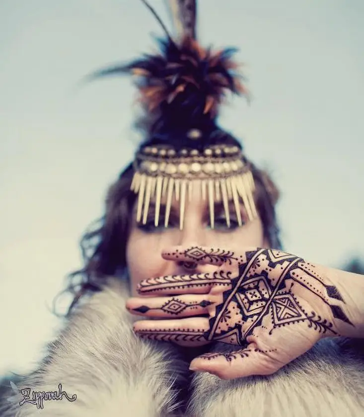 Portrait of Melodia wearing an elaborate headdress and intricate henna designs, capturing the creativity, imagination, and artistic expression celebrated in Melodia the Artist.