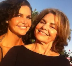 Melodia and Deborah Medley sharing a warm mother-daughter moment, reflecting the love, memory, and family connections explored in Ofrendas.