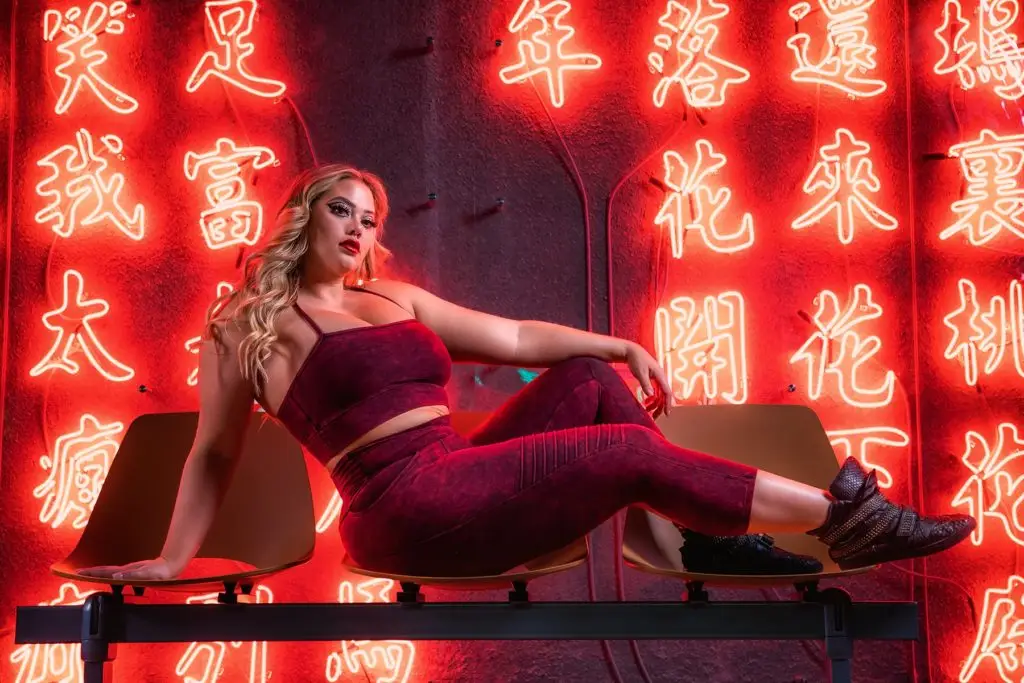Voluptuous woman posing in the Limited Edition Grunge Collection activewear.