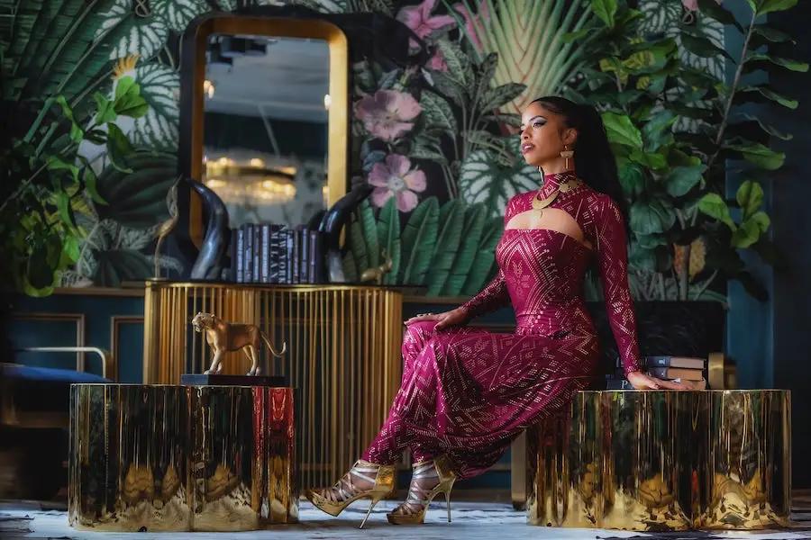 Luxor Collection Burgundy Egyptian-inspired dancewear set in elegant interior setting