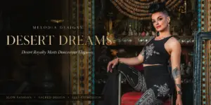 Model wearing Desert Dreams Collection dancewear in an ornate antique setting, showcasing black slow fashion designs with sacred geometry-inspired prints and desert royalty elegance.