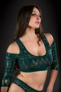 Model wearing the Malachite Assuit bra with gold geometric detailing.