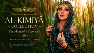 Featured image for the Al-Kīmiyā Collection: The Malachite Colorway by Melodia Designs featuring a model in emerald green Egyptian-inspired fashion with gold detailing, standing among lush reeds and wearing ornate metallic jewelry and a jeweled headpiece.