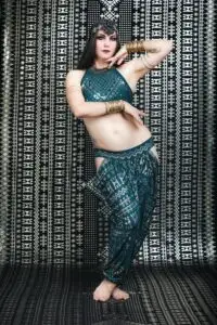 Model wearing the Malachite Assuit two-piece set with bra and harem pants.