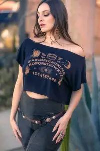 Woman wearing OUIJA Dede crop top and Rustique Moto leggings fashion outfit