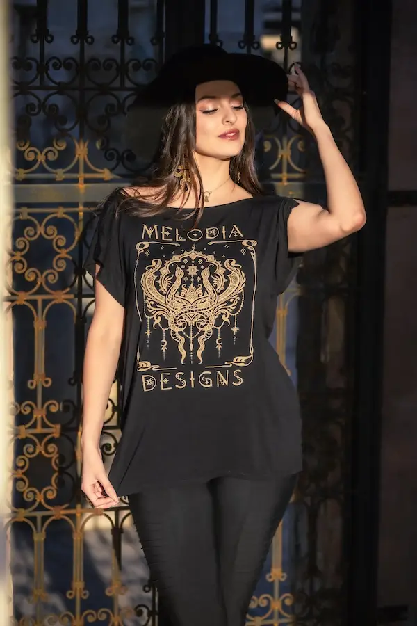 Serpentine visions fashion: Model wearing the eco-friendly Jade Tunic with a snake-inspired design.
