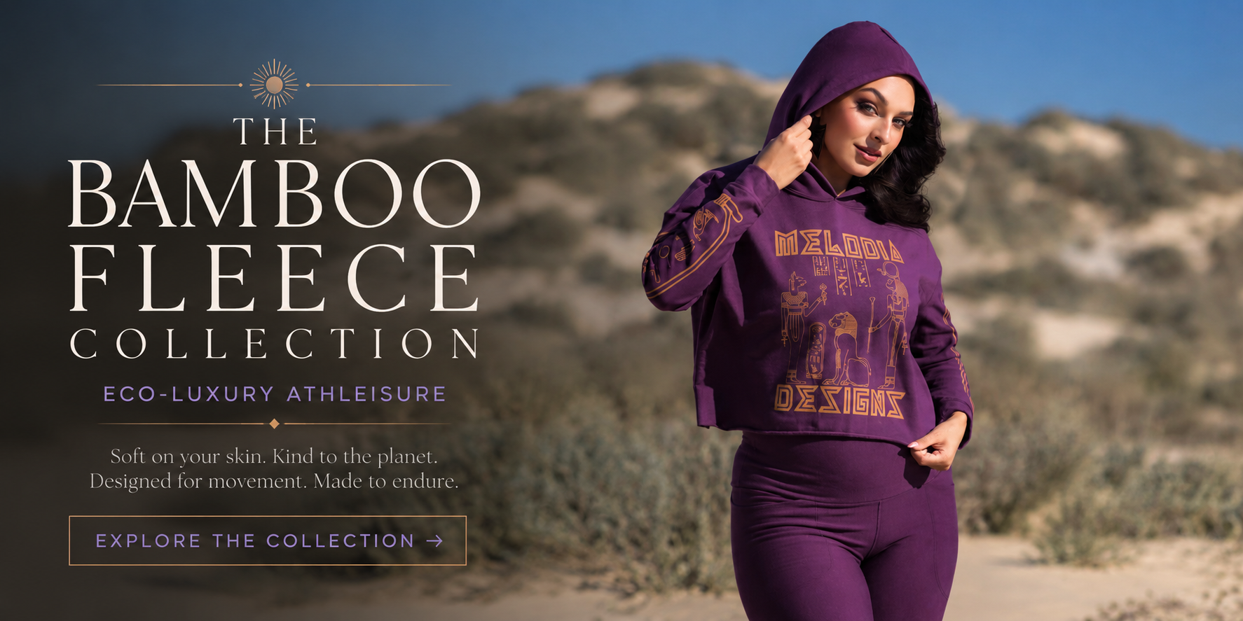 Featured image for the Bamboo Fleece Collection featuring a model in plum bamboo fleece athleisure standing in sunlit desert dunes, styled in eco-luxury activewear with soft neutral tones and elevated bohemian minimalism.