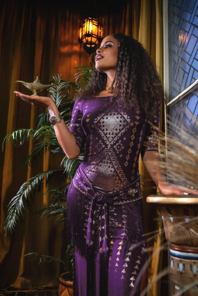 Aubergine Karnak Dress styled in vintage interior — a fusion of feminine power and slow fashion elegance.