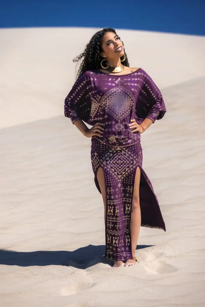 Full view of a Karnak pairing with Alkimiya in aubergine, highlighting fluid style and body-conscious design for modern goddesses.