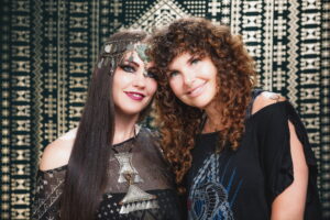 Melodia Designs founder Melodia with model wearing patterned sacred geometry outfit