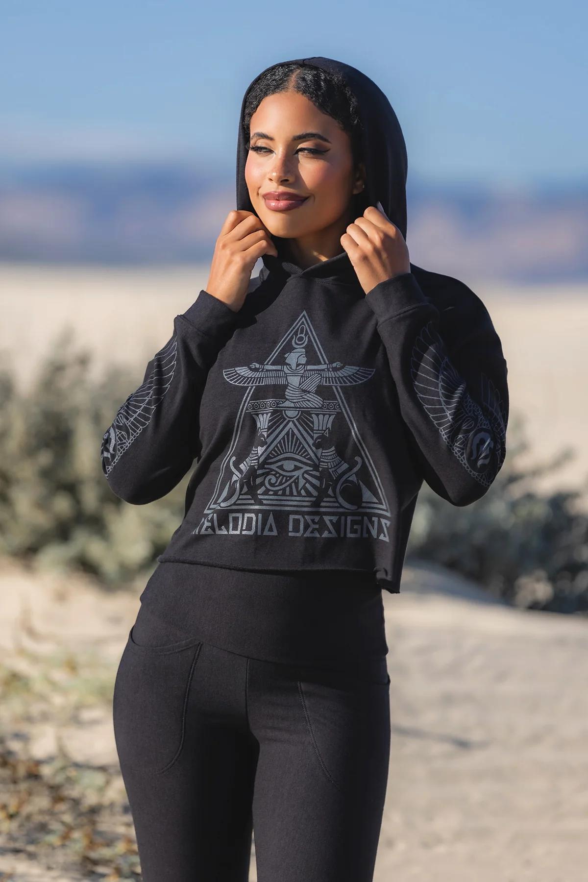 Fleece Black sacred geometry hoodie with matching leggings worn in desert landscape