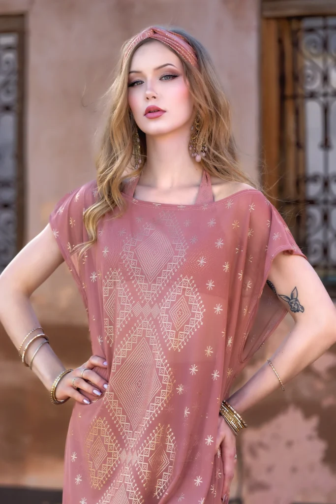 Close-up of Dendera Collection desert rose dress featuring intricate sacred geometry pattern and soft draped silhouette