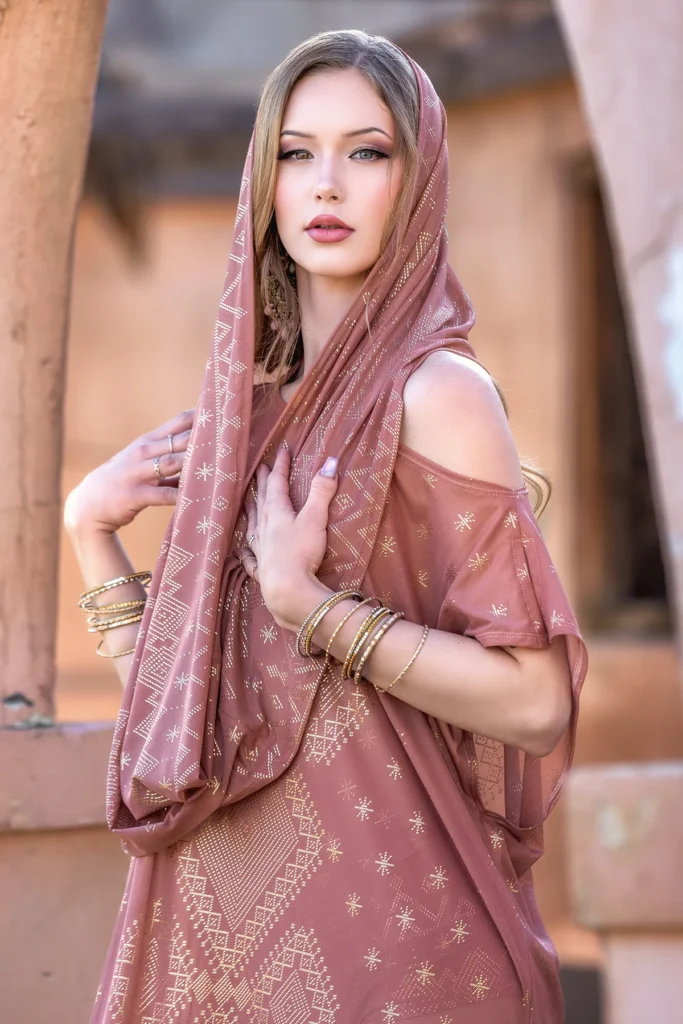 Model wearing Dendera Collection desert rose maxi dress with sacred geometry infinity scarf in soft draped styling