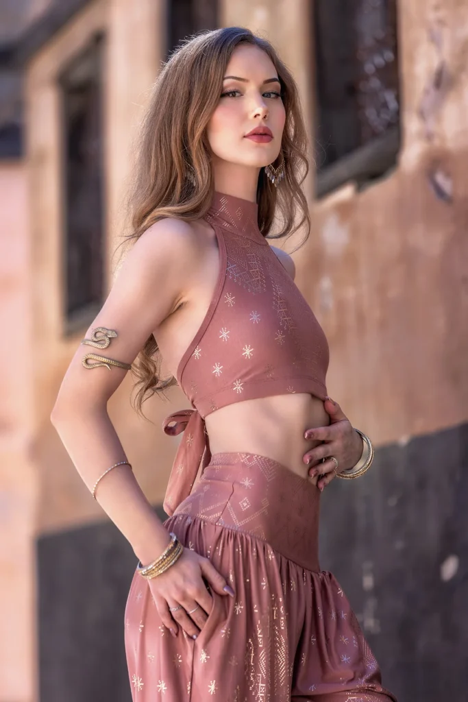 Close-up of the Desert Rose Dendera Collection two-piece ensemble showcasing gold sacred geometry patterns, delicate draping, and handcrafted details.